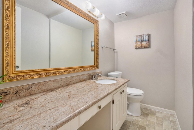 1145 Country Place Dr, Houston, TX 77079 - bathroom with toilet, baseboards, and vanity