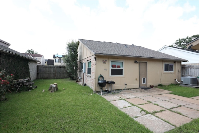 6416 Dawnridge Dr, Houston, TX 77035 - back of house with a patio area, roof with shingles, and central AC