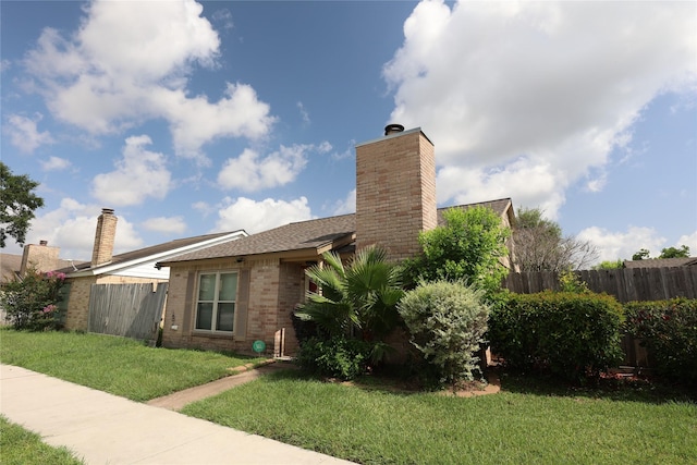 6416 Dawnridge Dr, Houston, TX 77035 - view of side of property with a chimney and brick siding