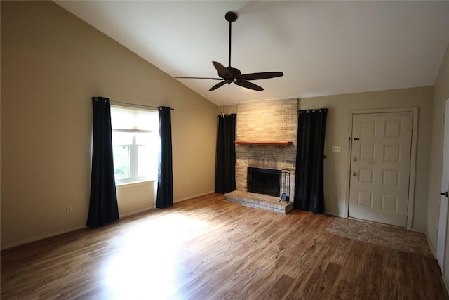 6416 Dawnridge Dr, Houston, TX 77035 - unfurnished living room featuring a ceiling fan, wood finished floors, vaulted ceiling, a brick fireplace, and baseboards