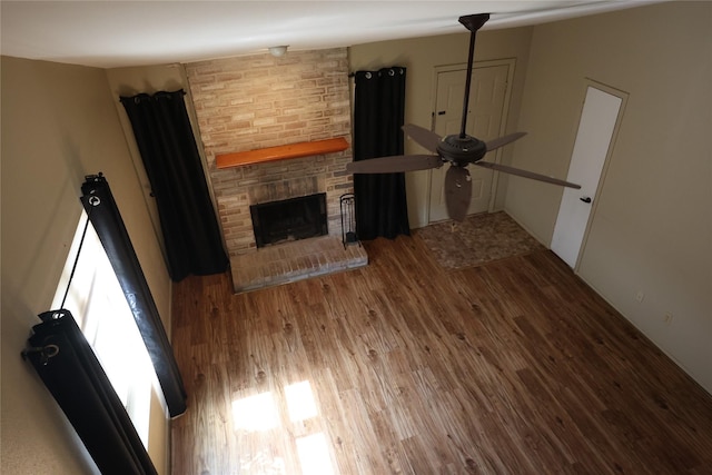 6416 Dawnridge Dr, Houston, TX 77035 - unfurnished living room with wood finished floors, a fireplace, and a ceiling fan