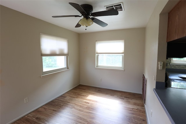 6416 Dawnridge Dr, Houston, TX 77035 - empty room featuring light wood finished floors, a ceiling fan, and baseboards