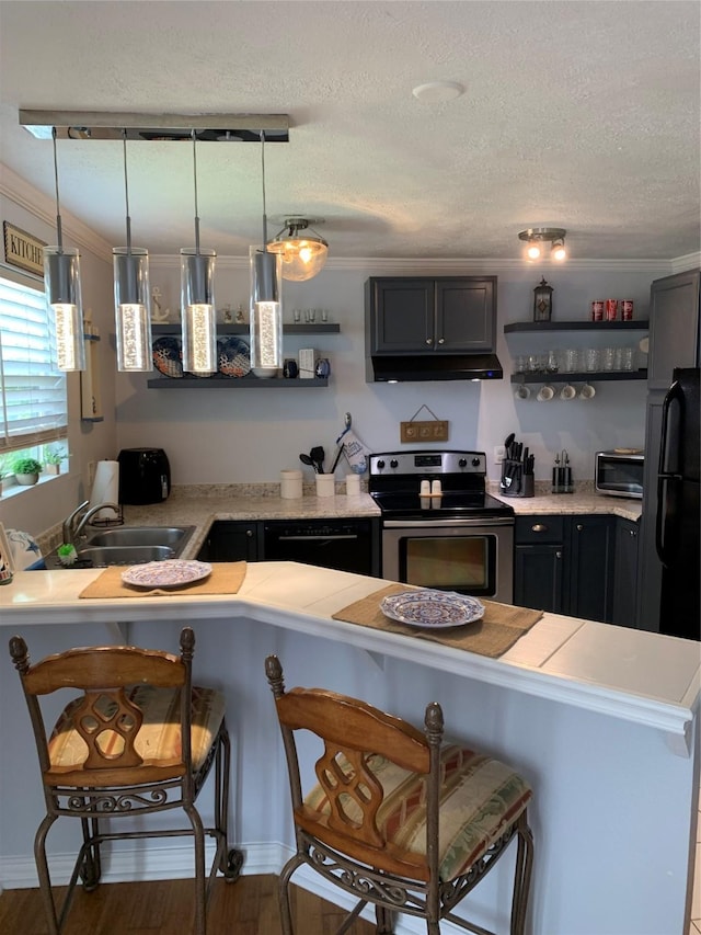 1609 E Bayshore Dr, Dickinson, TX 77539 - kitchen featuring electric stove, a sink, open shelves, light countertops, and a textured ceiling