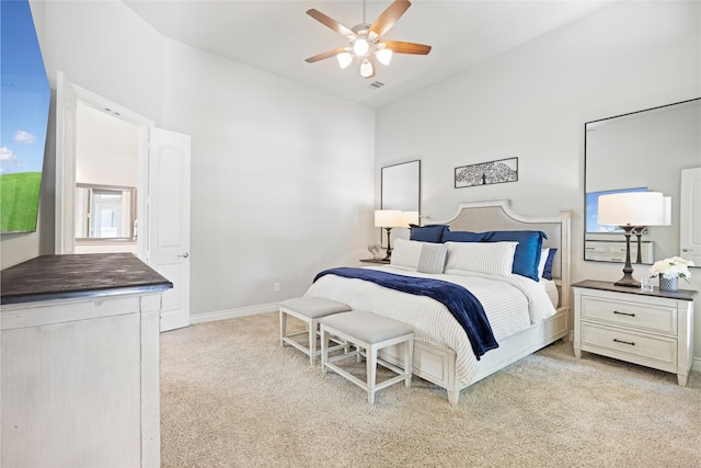 127 Evening Tide Ct, Conroe, TX 77318 - bedroom with light carpet, a towering ceiling, and a ceiling fan