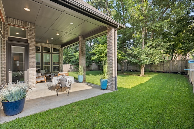127 Evening Tide Ct, Conroe, TX 77318 - view of yard with a patio