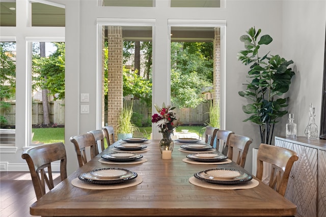 127 Evening Tide Ct, Conroe, TX 77318 - dining space featuring healthy amount of natural light and wood finished floors