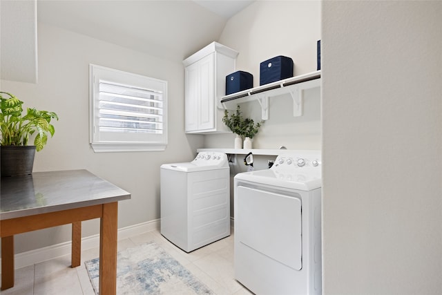 127 Evening Tide Ct, Conroe, TX 77318 - washroom featuring cabinet space, washing machine and clothes dryer, and baseboards
