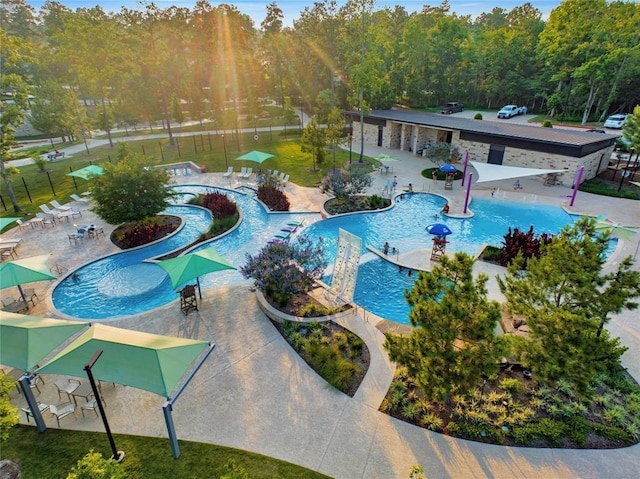127 Evening Tide Ct, Conroe, TX 77318 - community pool featuring a patio area