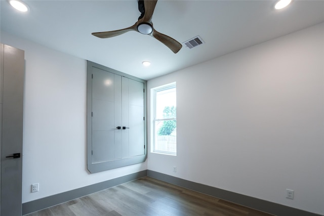 1053 W 15th 1/2 St, Houston, TX 77008 - unfurnished bedroom with dark wood-style flooring, recessed lighting, and ceiling fan