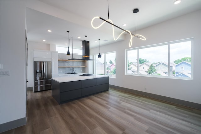 1053 W 15th 1/2 St, Houston, TX 77008 - kitchen with stainless steel fridge, island exhaust hood, modern cabinets, light countertops, and recessed lighting