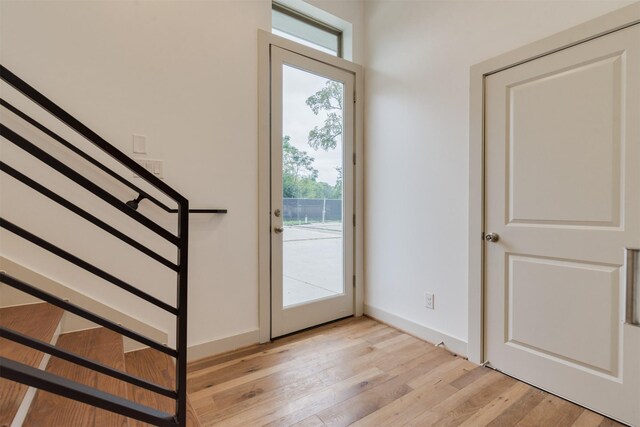 1414 Wichman St, Houston, TX 77007 - doorway with healthy amount of natural light and light wood-style floors