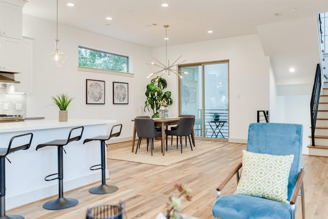 1414 Wichman St, Houston, TX 77007 - dining space with stairway, light wood-type flooring, a chandelier, recessed lighting, and baseboards