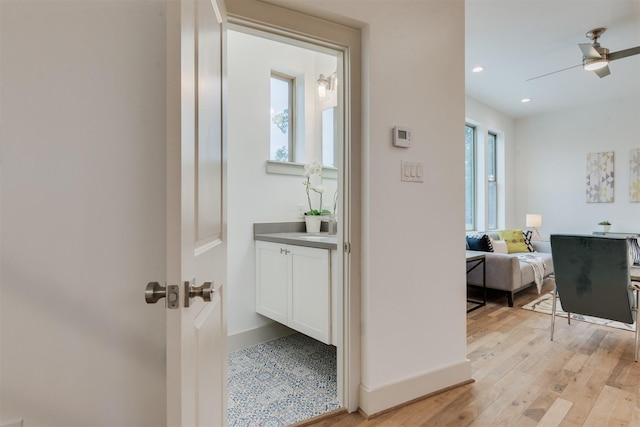 1414 Wichman St, Houston, TX 77007 - hallway featuring light wood-type flooring, recessed lighting, and baseboards