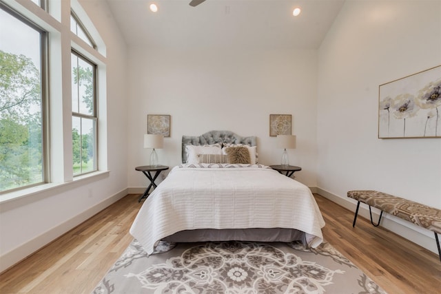 1414 Wichman St, Houston, TX 77007 - bedroom featuring multiple windows, vaulted ceiling, recessed lighting, baseboards, and light wood-style flooring