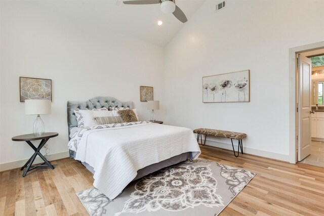 1414 Wichman St, Houston, TX 77007 - bedroom with high vaulted ceiling, light wood-style floors, baseboards, connected bathroom, and ceiling fan
