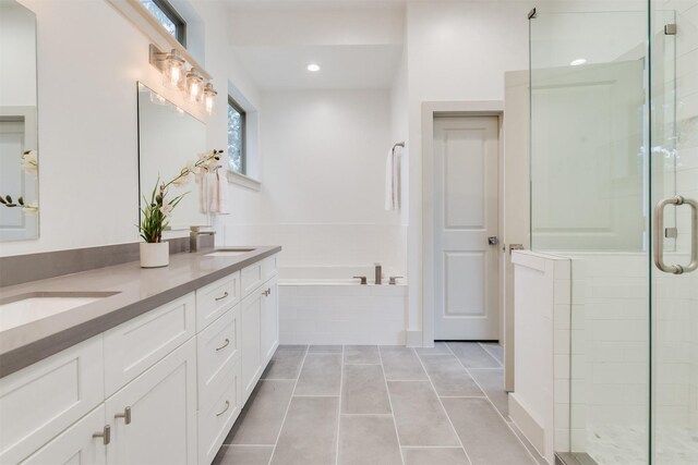 1414 Wichman St, Houston, TX 77007 - bathroom featuring a shower stall, double vanity, a bath, and tile patterned flooring