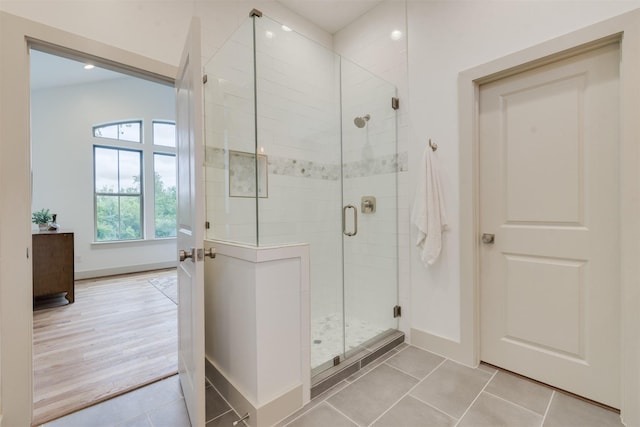 1414 Wichman St, Houston, TX 77007 - bathroom featuring a stall shower, baseboards, tile patterned flooring, and recessed lighting