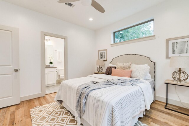 1414 Wichman St, Houston, TX 77007 - bedroom with light wood-type flooring, ensuite bath, a ceiling fan, baseboards, and recessed lighting