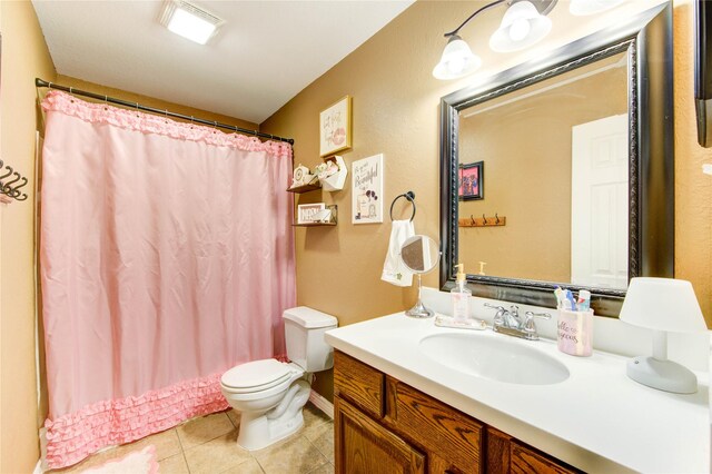 2714 San Marco Ln, League City, TX 77573 - bathroom with toilet, vanity, tile patterned floors, and curtained shower