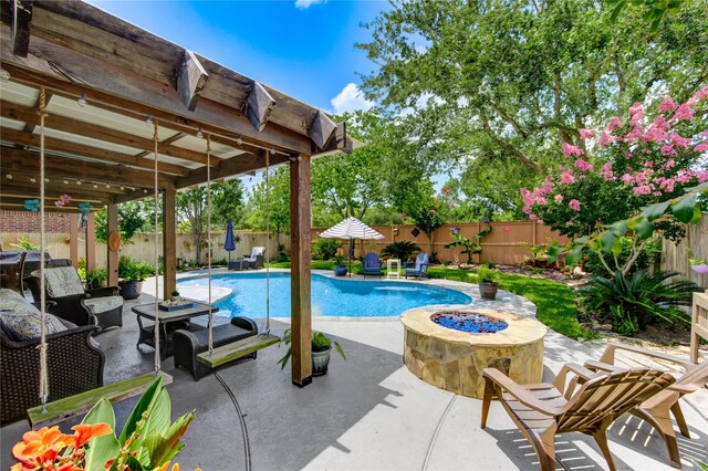 2714 San Marco Ln, League City, TX 77573 - view of swimming pool with an outdoor fire pit, a patio, and a fenced backyard