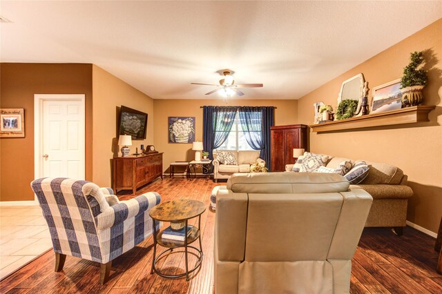 2714 San Marco Ln, League City, TX 77573 - living room with a ceiling fan, baseboards, and dark wood finished floors