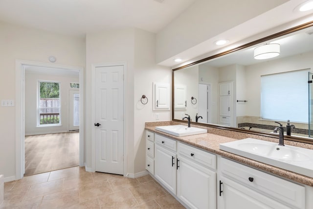 15 Prism Cove Pl, The Woodlands, TX 77381 - full bath with double vanity, baseboards, and recessed lighting