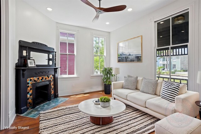 1416 Rosenberg St, Galveston, TX 77550 - living area featuring wood finished floors, ceiling fan, a fireplace with flush hearth, baseboards, and recessed lighting