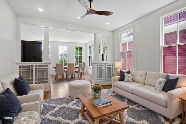1416 Rosenberg St, Galveston, TX 77550 - living room featuring healthy amount of natural light, wood finished floors, ceiling fan, decorative columns, and recessed lighting