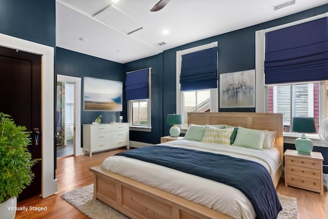 1416 Rosenberg St, Galveston, TX 77550 - bedroom with attic access and wood finished floors