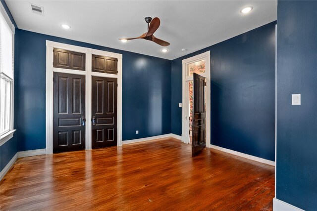 1416 Rosenberg St, Galveston, TX 77550 - unfurnished bedroom with wood finished floors, baseboards, recessed lighting, and a ceiling fan