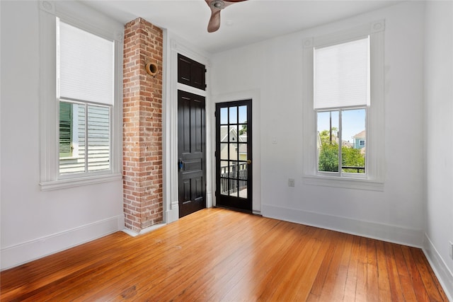 1416 Rosenberg St, Galveston, TX 77550 - spare room featuring hardwood / wood-style floors, plenty of natural light, baseboards, and a ceiling fan