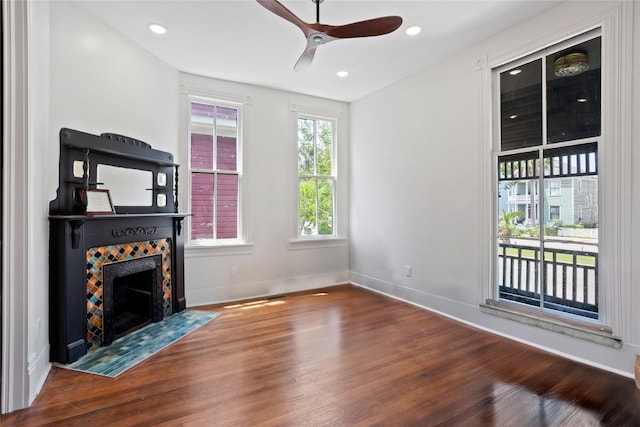 1416 Rosenberg St, Galveston, TX 77550 - unfurnished living room with wood finished floors, ceiling fan, a fireplace, baseboards, and recessed lighting