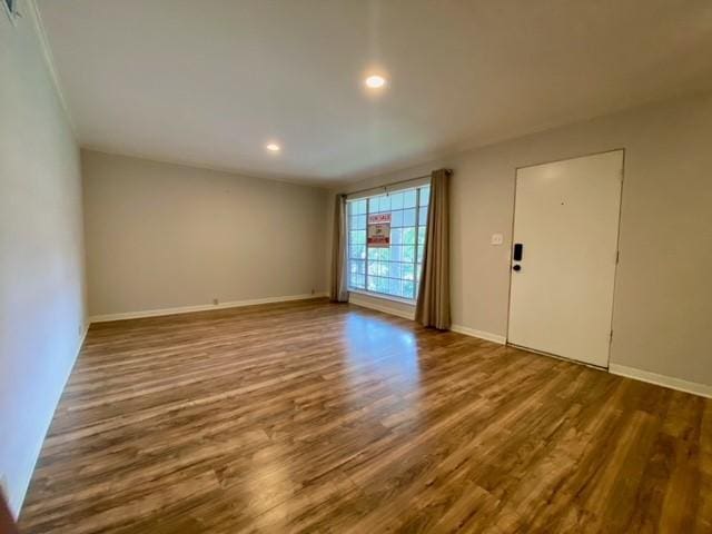 2121 Fountain View Dr Unit 8, Houston, TX 77057 - empty room featuring wood finished floors, baseboards, and recessed lighting