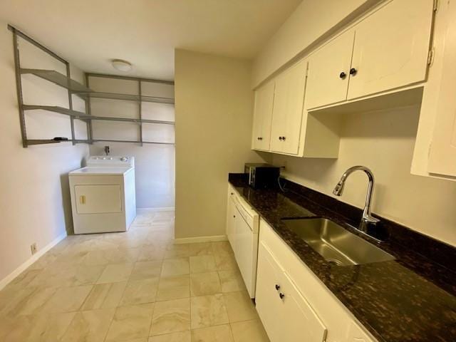 2121 Fountain View Dr Unit 8, Houston, TX 77057 - kitchen featuring washer / dryer, a sink, white dishwasher, white cabinets, and baseboards