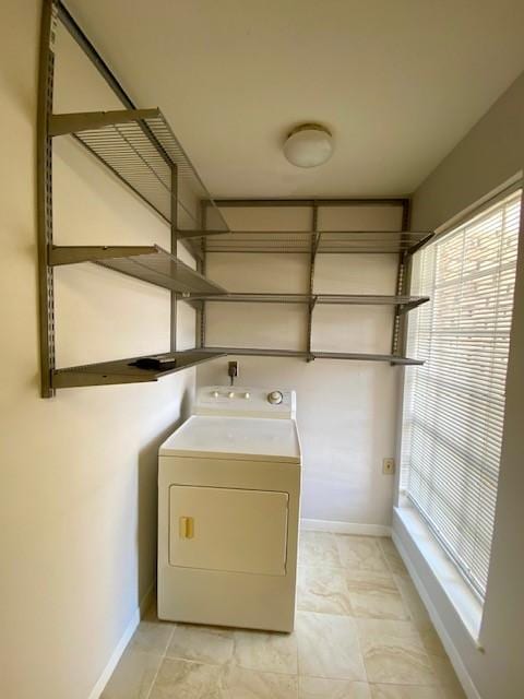2121 Fountain View Dr Unit 8, Houston, TX 77057 - laundry room featuring washer / dryer and baseboards