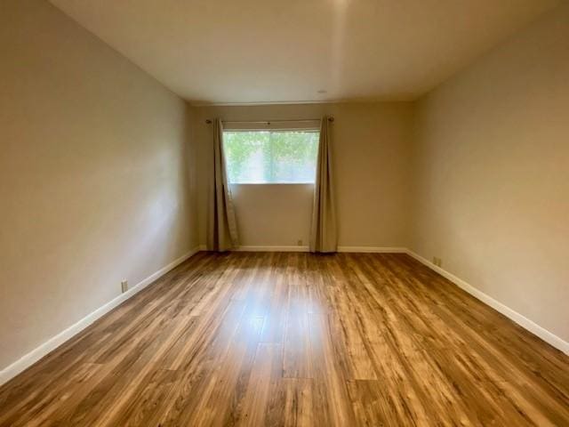 2121 Fountain View Dr Unit 8, Houston, TX 77057 - empty room featuring wood finished floors and baseboards