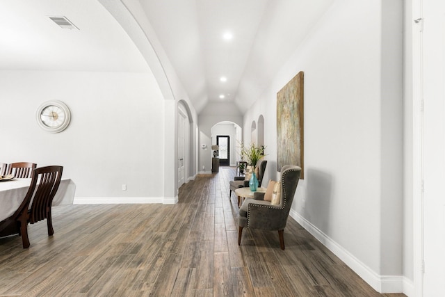 23672 Crossworth Dr, New Caney, TX 77357 - hall featuring arched walkways, lofted ceiling, baseboards, recessed lighting, and wood finished floors