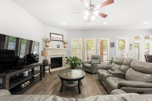 23672 Crossworth Dr, New Caney, TX 77357 - living room with a ceiling fan, wood finished floors, recessed lighting, a fireplace with raised hearth, and plenty of natural light