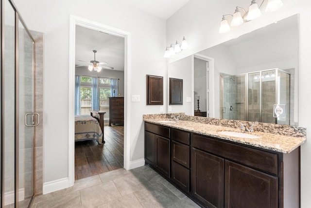 23672 Crossworth Dr, New Caney, TX 77357 - full bathroom with connected bathroom, baseboards, a shower stall, and ceiling fan