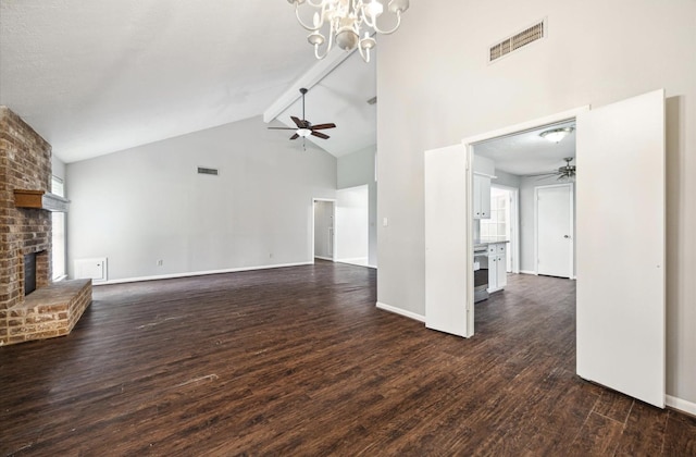 25903 Long Hill Ln, Spring, TX 77373 - unfurnished living room featuring a fireplace, a ceiling fan, dark wood-type flooring, high vaulted ceiling, and a chandelier