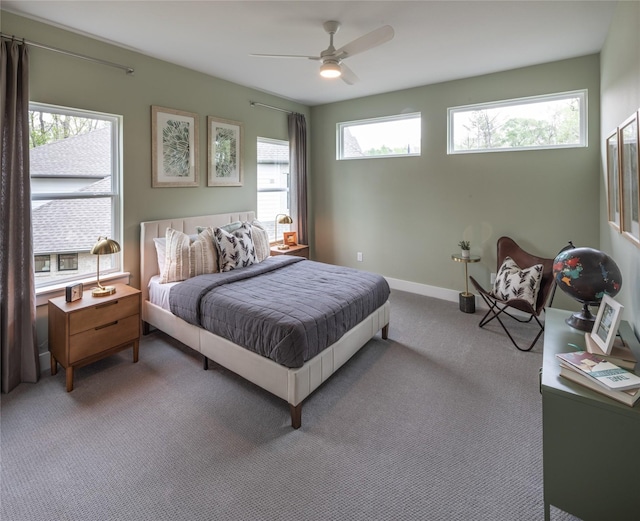 21742 Grayson Highlands Way, Porter Heights, TX 77365 - carpeted bedroom with ceiling fan and baseboards