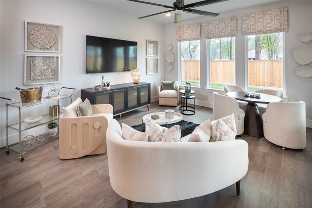 21742 Grayson Highlands Way, Porter Heights, TX 77365 - living room featuring wood finished floors, ceiling fan, and baseboards