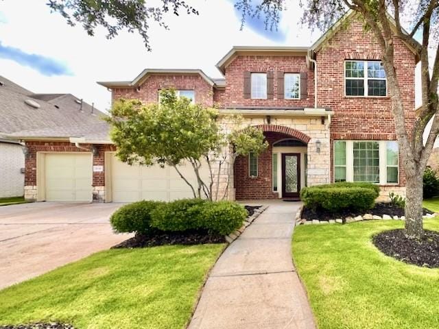 10410 Hatcher Dr, Katy, TX 77494 - traditional home with a front lawn, concrete driveway, brick siding, and a garage