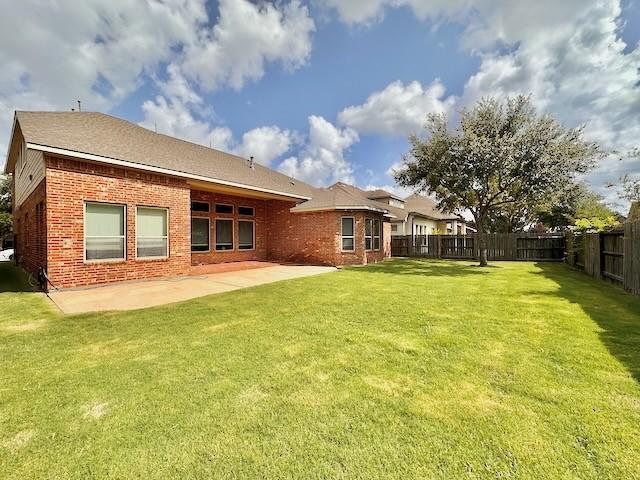 10410 Hatcher Dr, Katy, TX 77494 - back of house with brick siding and a patio