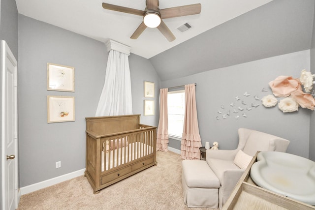 14006 Alex Landing Dr, Humble, TX 77396 - carpeted bedroom with a crib, vaulted ceiling, baseboards, and a ceiling fan