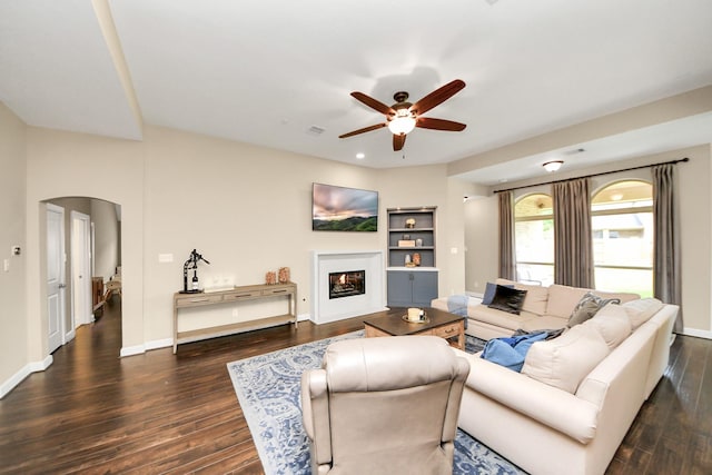 14006 Alex Landing Dr, Humble, TX 77396 - living area featuring a ceiling fan, arched walkways, wood finished floors, and built in features