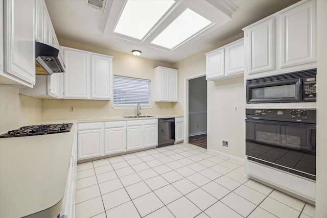 16403 Wellers Way, Houston, TX 77095 - kitchen featuring black appliances, a sink, white cabinetry, light countertops, and wall chimney exhaust hood