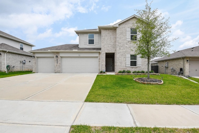 12324 Carib Crossing Ln, Conroe, TX 77304 - traditional-style house featuring concrete driveway, a front lawn, an attached garage, and brick siding
