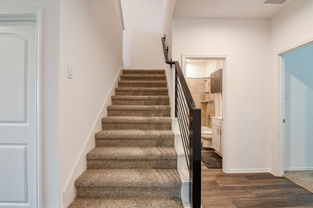 12324 Carib Crossing Ln, Conroe, TX 77304 - staircase featuring wood finished floors and baseboards