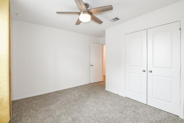 12324 Carib Crossing Ln, Conroe, TX 77304 - unfurnished bedroom with carpet flooring, a closet, a ceiling fan, and baseboards